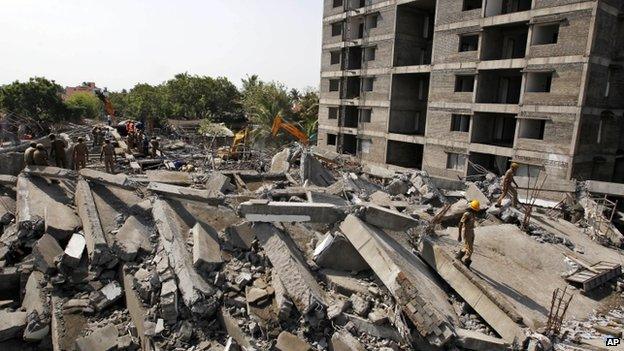 The wreckage of the collapsed building seen in daylight on Sunday - 29 June