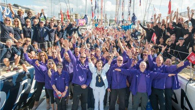 The Clipper teams were led to their yachts by the city's mayor Brenda Stevenson