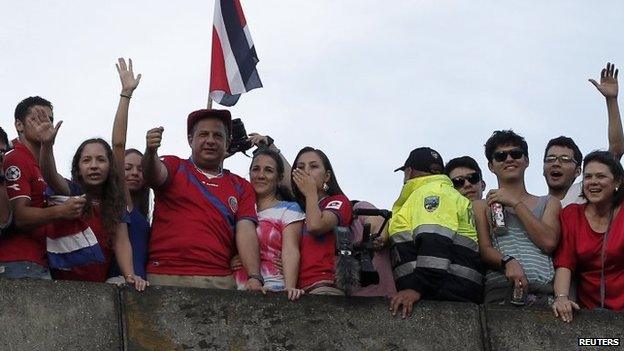 Costa Rican President Luis Guillermo Solis celebrates with fans in San Jose on 29 June, 2014