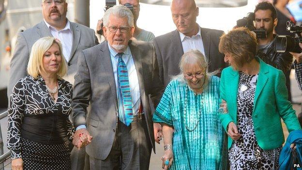 Rolf Harris arrives at court on 30 June 2014 with daughter Bindi (l), wife Alwen (r) and niece Jenny (second r)