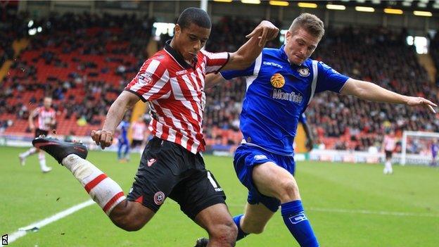 Sheffield United's Lyle Taylor gets cross over before challenge from Crewe Alexandra's Adam Dugdale