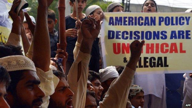 Pakistani activists of the banned charity organisation Jamat-ud-Dawa (JuD) shout slogans during an anti-US protest in Lahore on 27 June 27 2014