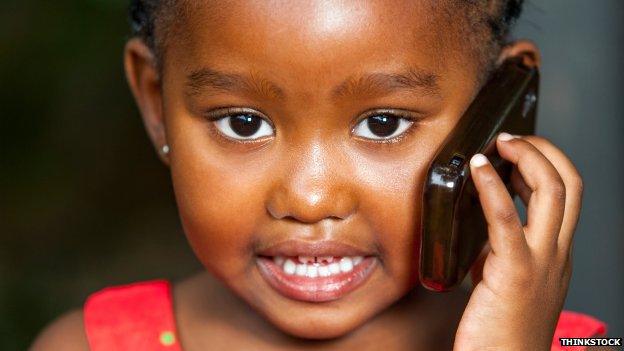 Young African girl talking on mobile