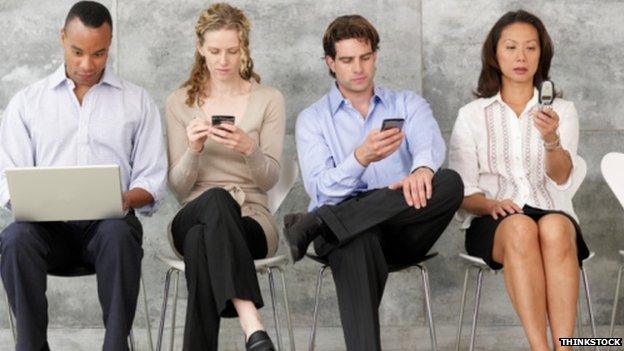 Four people on phones