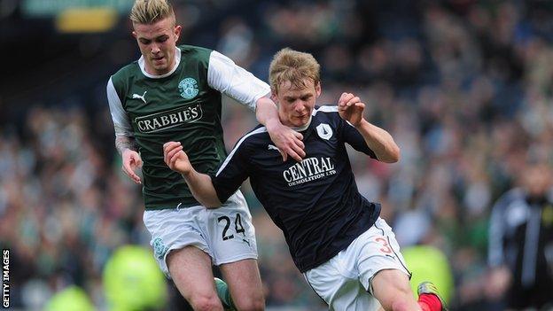 Stephen Kingsley of Falkirk battles with Daniel Handling of Hibernian