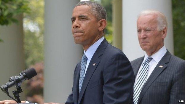 US President Barack Obama speaks in the Rose Garden on immigration reform as US Vice President Joe Biden listens 30 June 2014