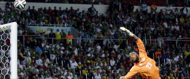 Algeria's goalkeeper Rais Mbolhi dives for the ball