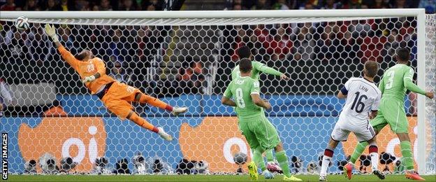 Philipp Lahm forces a fine save from Rais Mbolhi