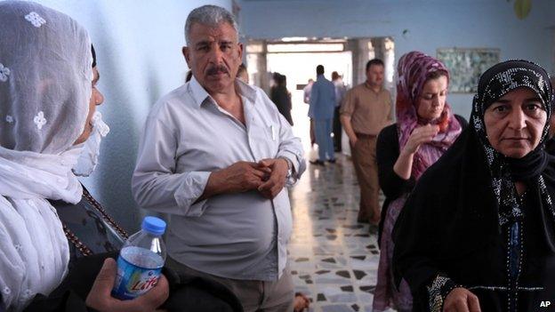 Relatives of Kurdish peshmerga fighters, wounded in fighting with Isis militants, visit a hospital in Irbil, a city in the Kurdish controlled north 350km north of Baghdad