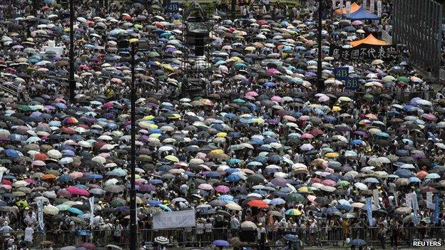 Thousands of pro-democracy protesters gather to march in the streets to demand universal suffrage in Hong Kong on 1 July, 2014