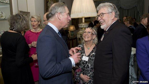 Prince Charles with Harris and his wife