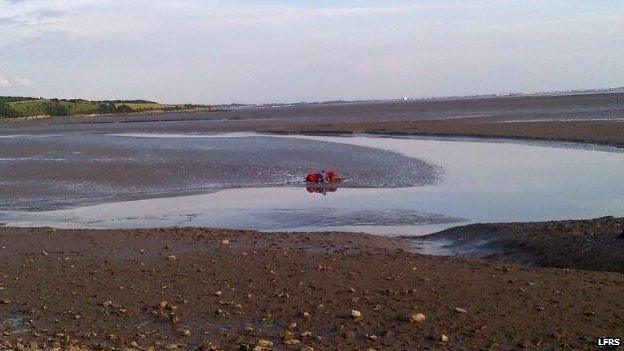 Fire crews rescue a boy from Morecambe Bay quicksand