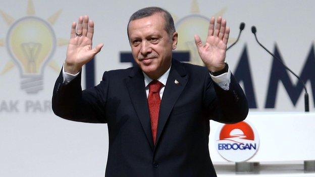 Turkish PM Recep Tayyip Erdogan gestures to members of Turkey's ruling Justice and Development Party (AKP) on 1 July 2014 in Ankara.