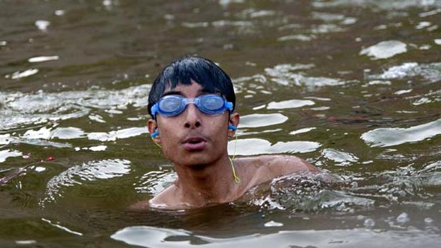 Boy wearing goggles in the Ganges