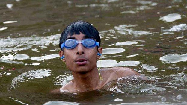 Boy wearing goggles in the Ganges