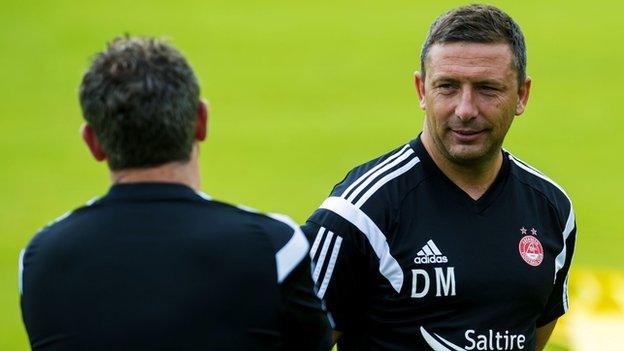 Aberdeen manager Derek McInnes chats to Tony Docherty