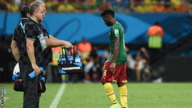 Cameroon midfielder Alex Song (right