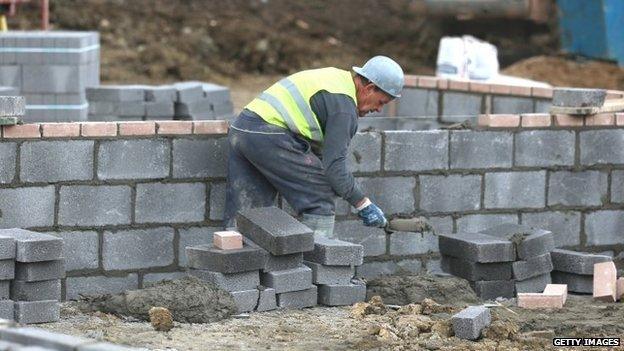 Man laying bricks