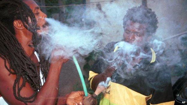 A Rastafarian smoking marijuana, a sacrament in their religion