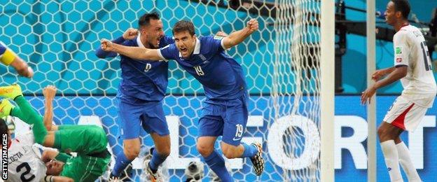 Greece's Sokratis Papastathopoulos celebrates a late equaliser against Costa Rica