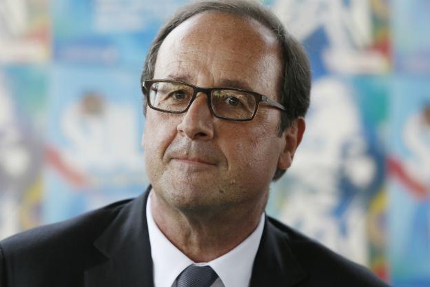 French President Francois Hollande looks on during a meeting with Solidays festival volunteer in Paris - 29 June 2014