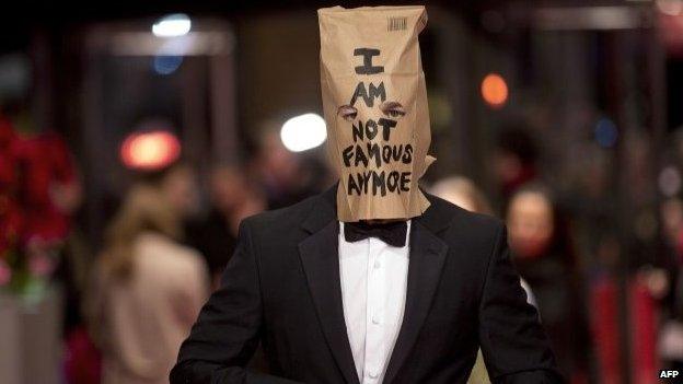 Shia LaBeouf with a paper bag on his head