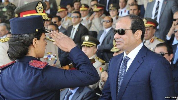 Egypt President Abdul Fattah al-Sisi (R) at a military graduation ceremony in Cairo on 24 June