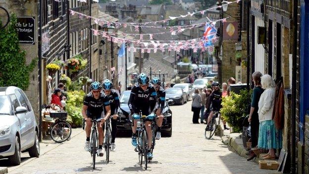 Chris Froome and Richie Porte cycling through Haworth