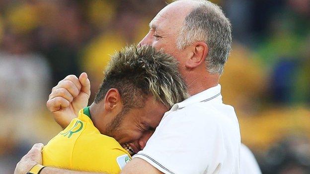 Brazil manager Luiz Felipe Scoalri (right) hugs Neymar after the win over Chile on penalties