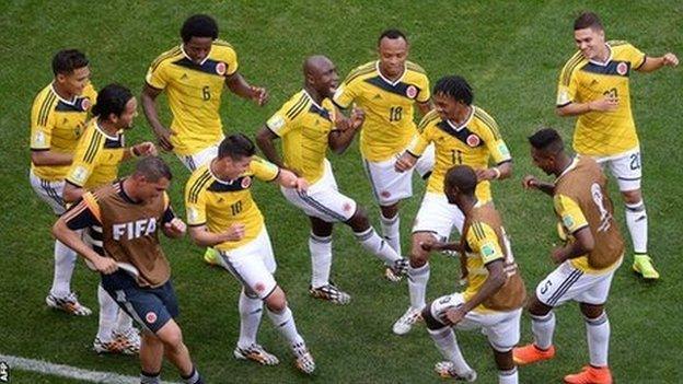 Colombia players celebrate a goal at the 2014 World Cup