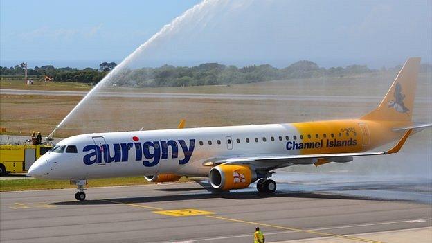 Aurigny Embraer 195 being greeted by a water salute after landing at Guernsey Airport for the first time