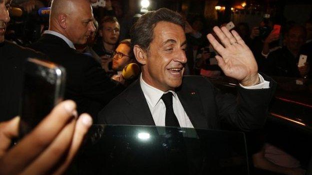 Former French President Nicolas Sarkozy leaves a restaurant in Paris on 2 July 2014.