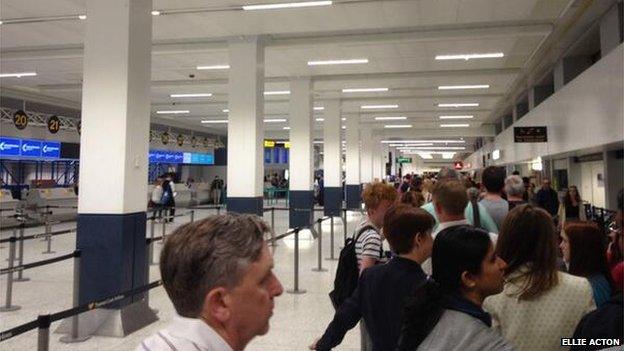 People queuing in an airport