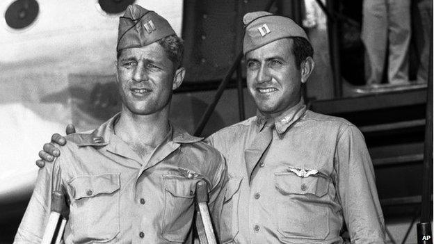 Capt. Louis Zamperini, right, of Torrance, Calif., and Capt. Fred Garrett of Riverside, Calif., arrive at Hamilton Air Field, later Hamilton Air Force Base, in Novato, California 3 October 1945