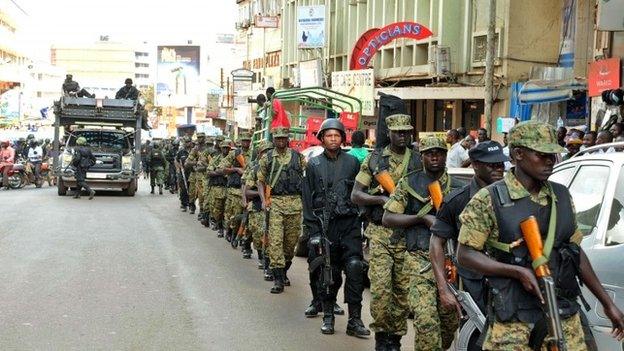 Soldiers and police patrol Kampala on 3 July 2014