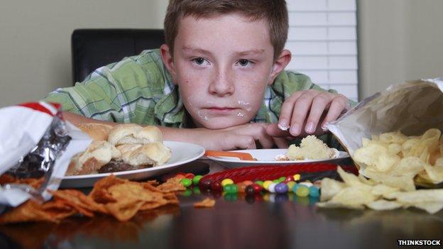 Child with a table full of food