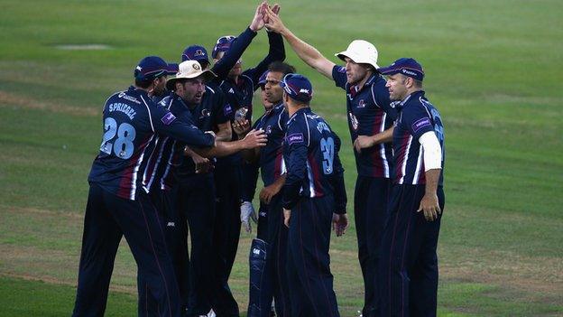 Northants players celebrate the dismissal of Shoaib Malik