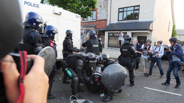 Police were attacked by loyalists in the Woodvale area of north Belfast on 12 July 2013 after the same parade was restricted