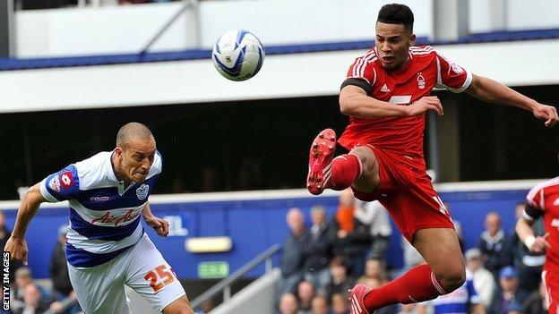 Jamaal Lascelles (right) attempts to thwart QPR's Bobby Zamora