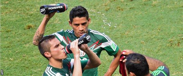 Mexico players take a 'cooling break' at the 2014 World Cup