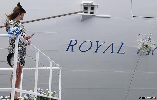 The Duchess of Cambridge watches a bottle of champagne smash against the Royal Princess ship