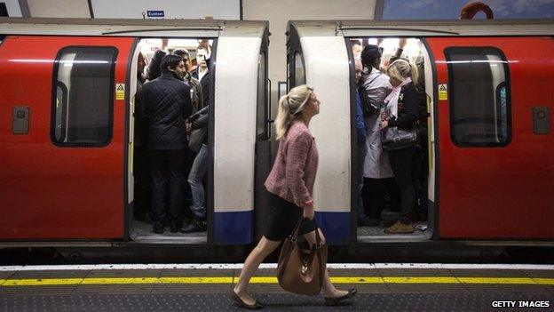 Commuters on a crowded Northern Line tube train