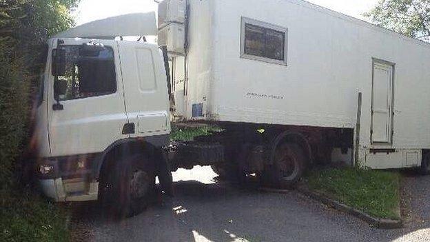 Articulated lorry wedge in a rural lane at Watton At Stone