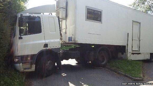 Articulated lorry wedge in a rural lane at Watton At Stone