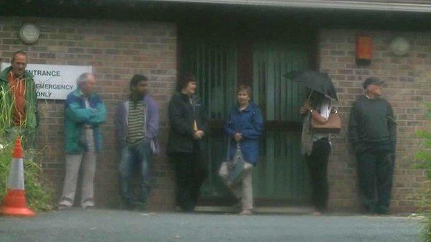 People queuing outside a Pembrokeshire GP surgery