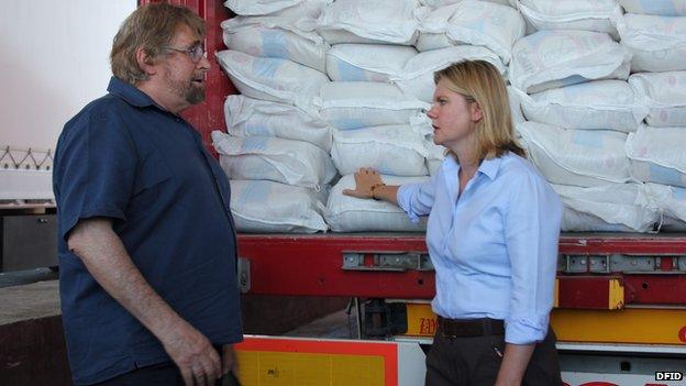 Justine Greening and a Mercy Corps member