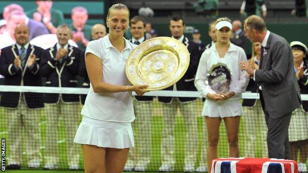 Petra Kvitova poses with the winner's Venus Rosewater Dish