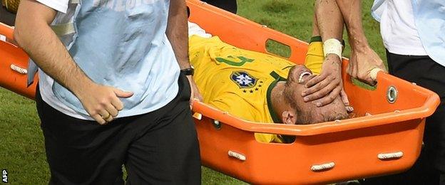 Neymar is carried off on a stretcher