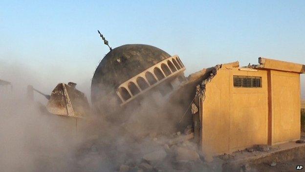 A bulldozer destroys Sunni Ahmed al-Rifai shrine and tomb in Mahlabiya district outside of Tal Afar, Iraq.