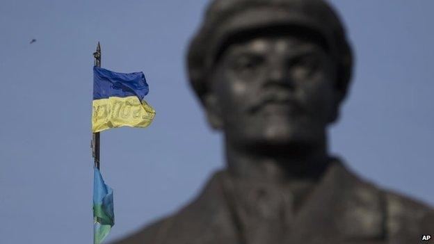 A Ukrainian flag is seen over a government building in the city of Sloviansk, Donetsk Region, eastern Ukraine Saturday, July 5